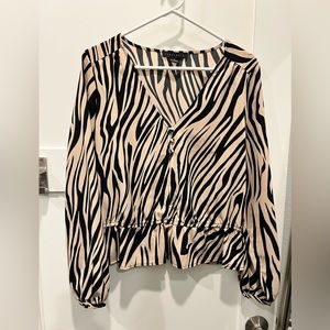 Gently used blouse / tan colored zebra strip